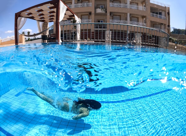 Outdoor pool, pool umbrellas, pool loungers