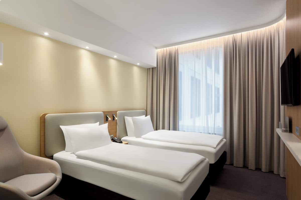 Hypo-allergenic bedding available, in-room safe, laptop workspace
