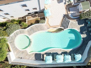 Seasonal outdoor pool, open 9:00 AM to 6:00 PM, pool umbrellas
