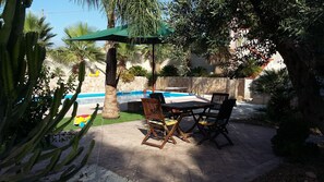 Seasonal outdoor pool, pool umbrellas, pool loungers
