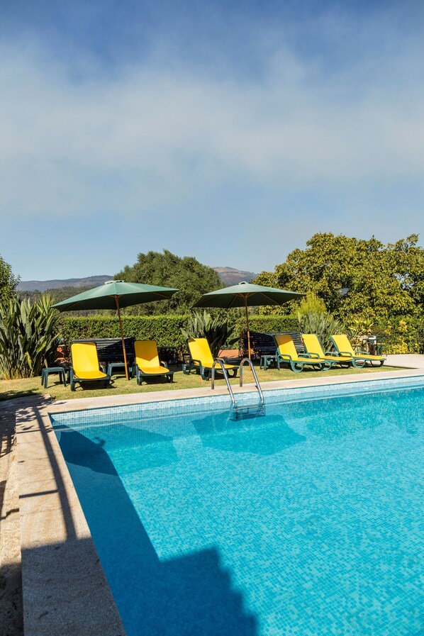 Seasonal outdoor pool, pool umbrellas, pool loungers