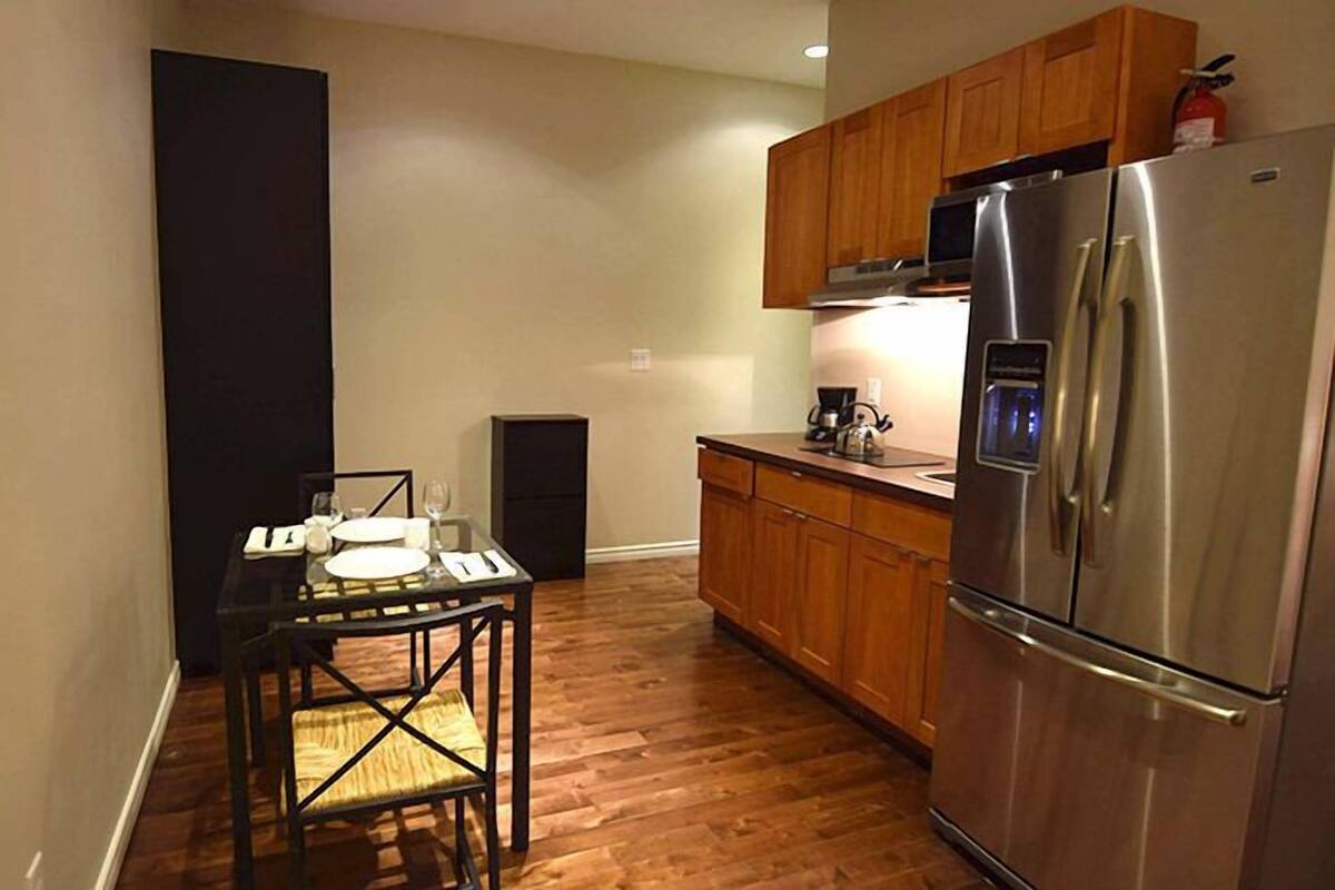 suite, 1 king bed | private kitchenette | full-sized fridge, microwave, coffee/tea maker, cookware/dishes/utensils