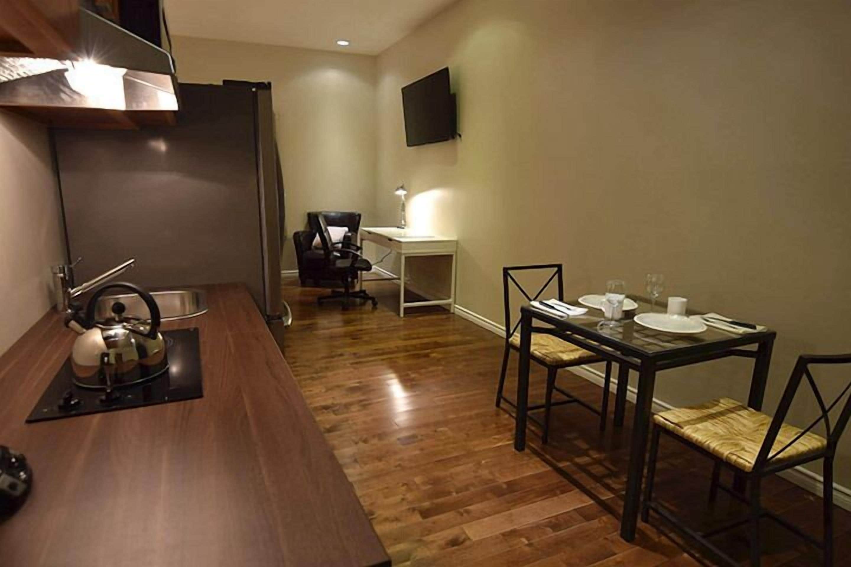 suite, 1 king bed | private kitchenette | full-sized fridge, microwave, coffee/tea maker, cookware/dishes/utensils