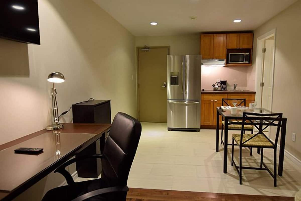 suite, 1 queen bed | private kitchenette | full-sized fridge, microwave, coffee/tea maker, cookware/dishes/utensils