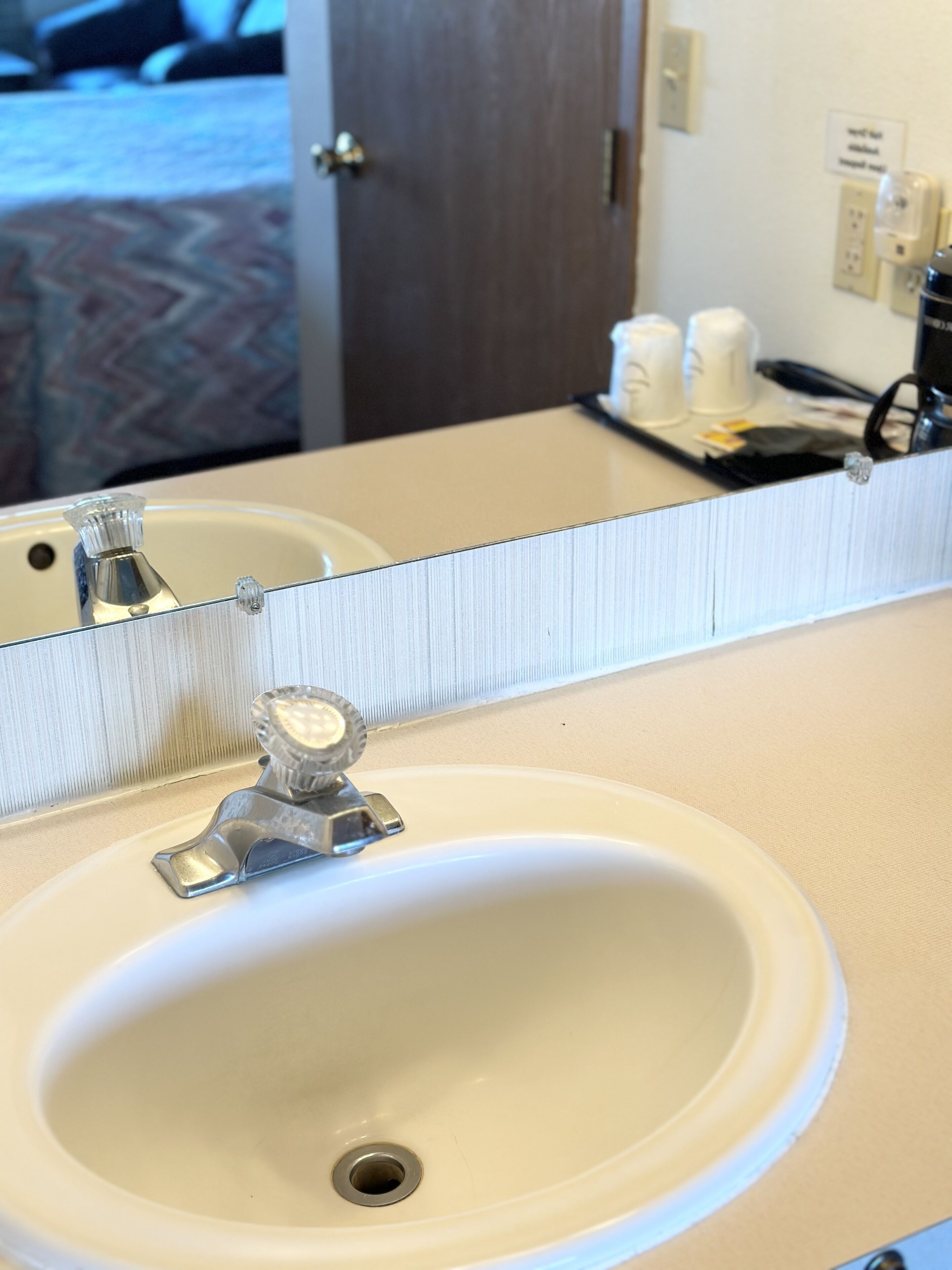 A bathroom sink with a mirror above it.