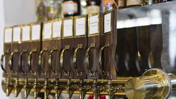 A row of beer taps with labels, each indicating a different type of beer.