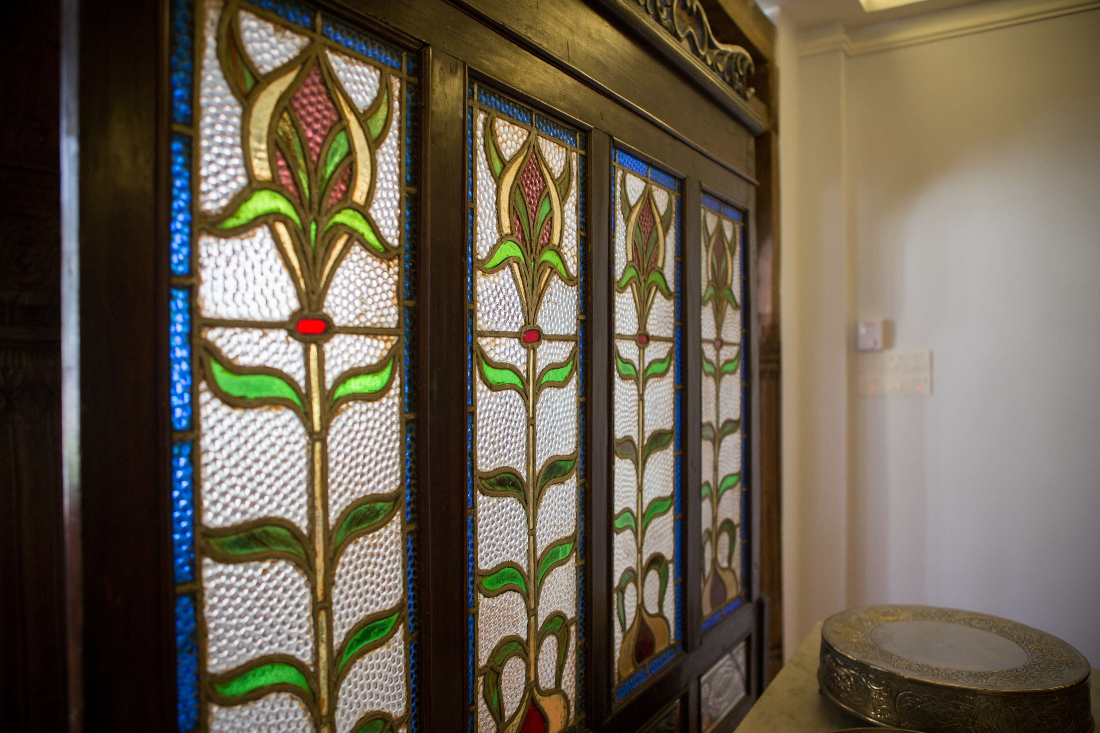 A stained glass window with floral patterns.