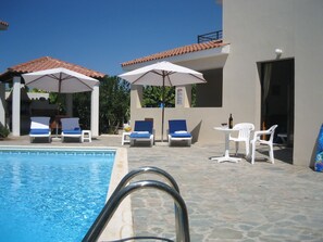 Outdoor pool, pool umbrellas, sun loungers