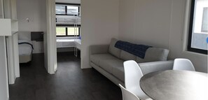 Deluxe Parkview (6 Berth) | Living room | Flat-screen TV - Beachcomber Holiday Park (Potato Point)