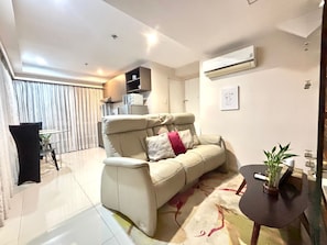 Max Premiere | Living area | 43-inch Smart TV with digital channels - MaxStays Max Style at Fort Victoria (Taguig)