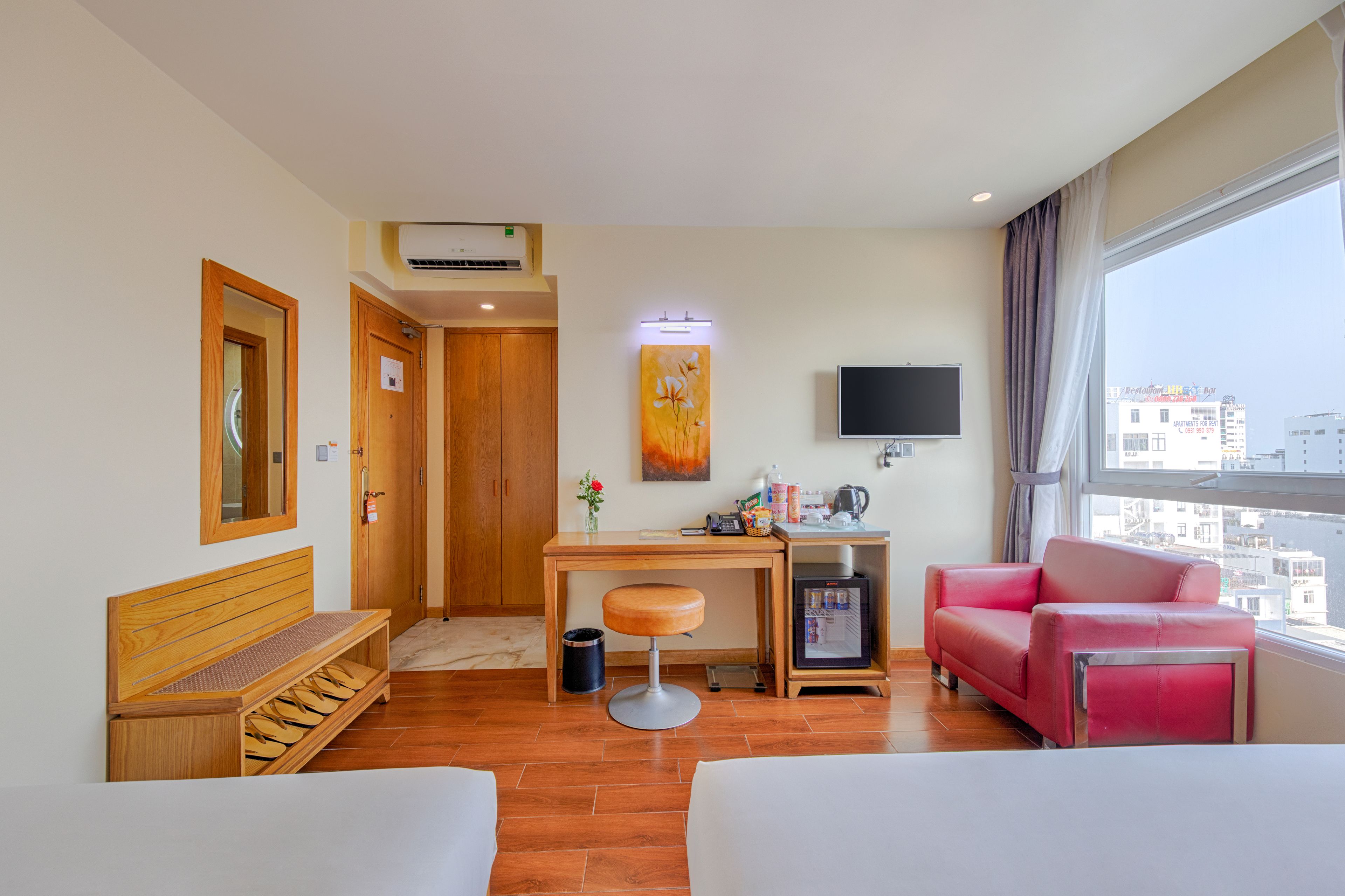 family triple room, multiple beds, city view | view from room