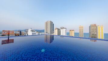 Enjoy breathtaking views of the city from our rooftop infinity pool.