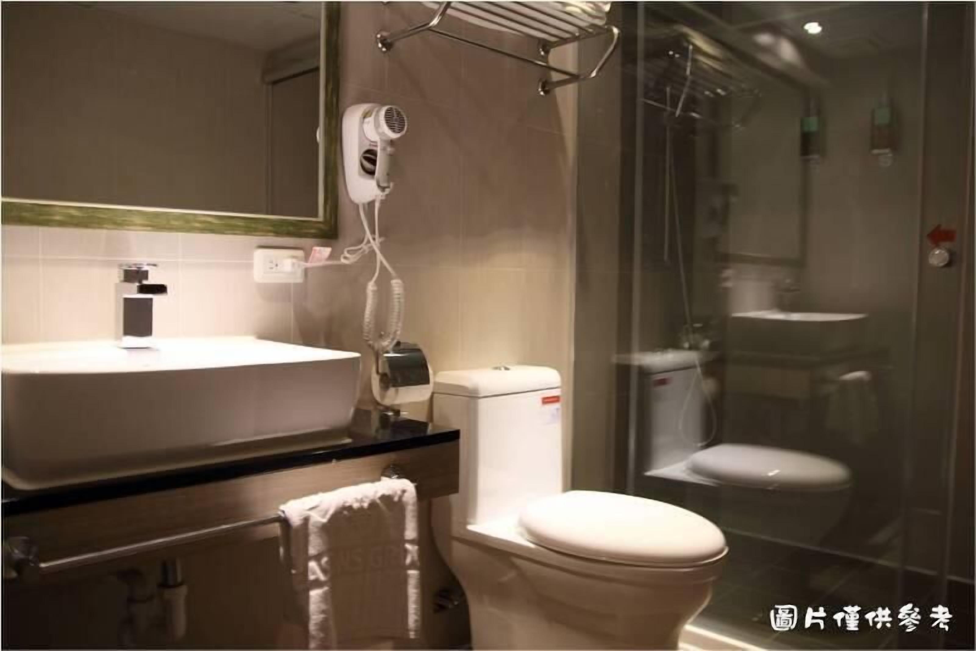 shower, hair dryer, slippers, towels