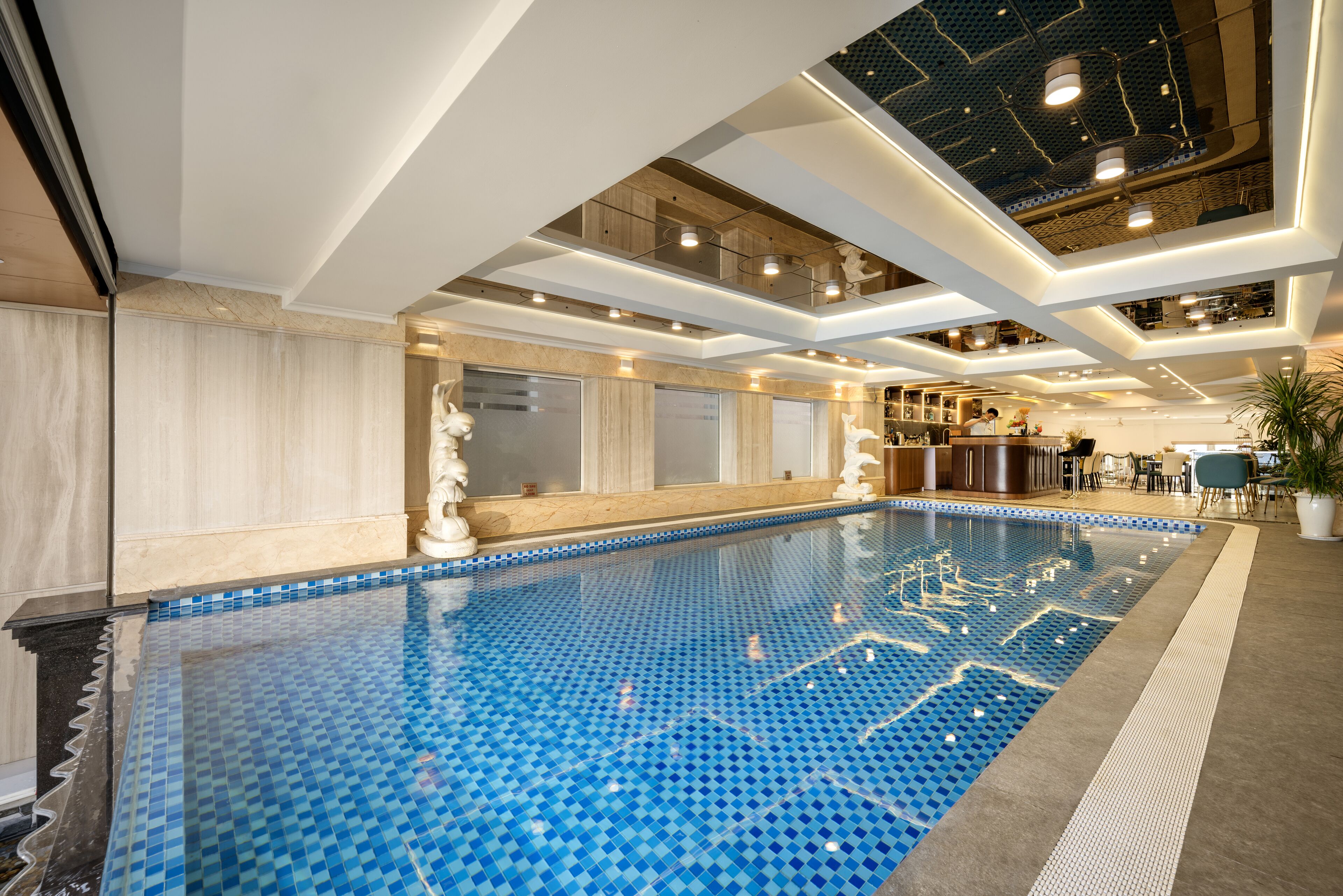 Indoor pool, open 7:00 AM to 8:00 PM, pool umbrellas, sun loungers