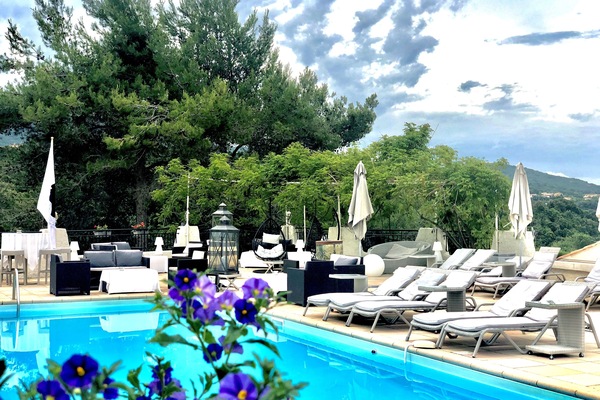 Seasonal outdoor pool, open 9:00 AM to 9:00 PM, pool umbrellas