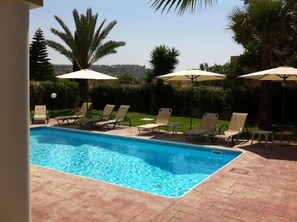 Outdoor pool, pool umbrellas, sun loungers