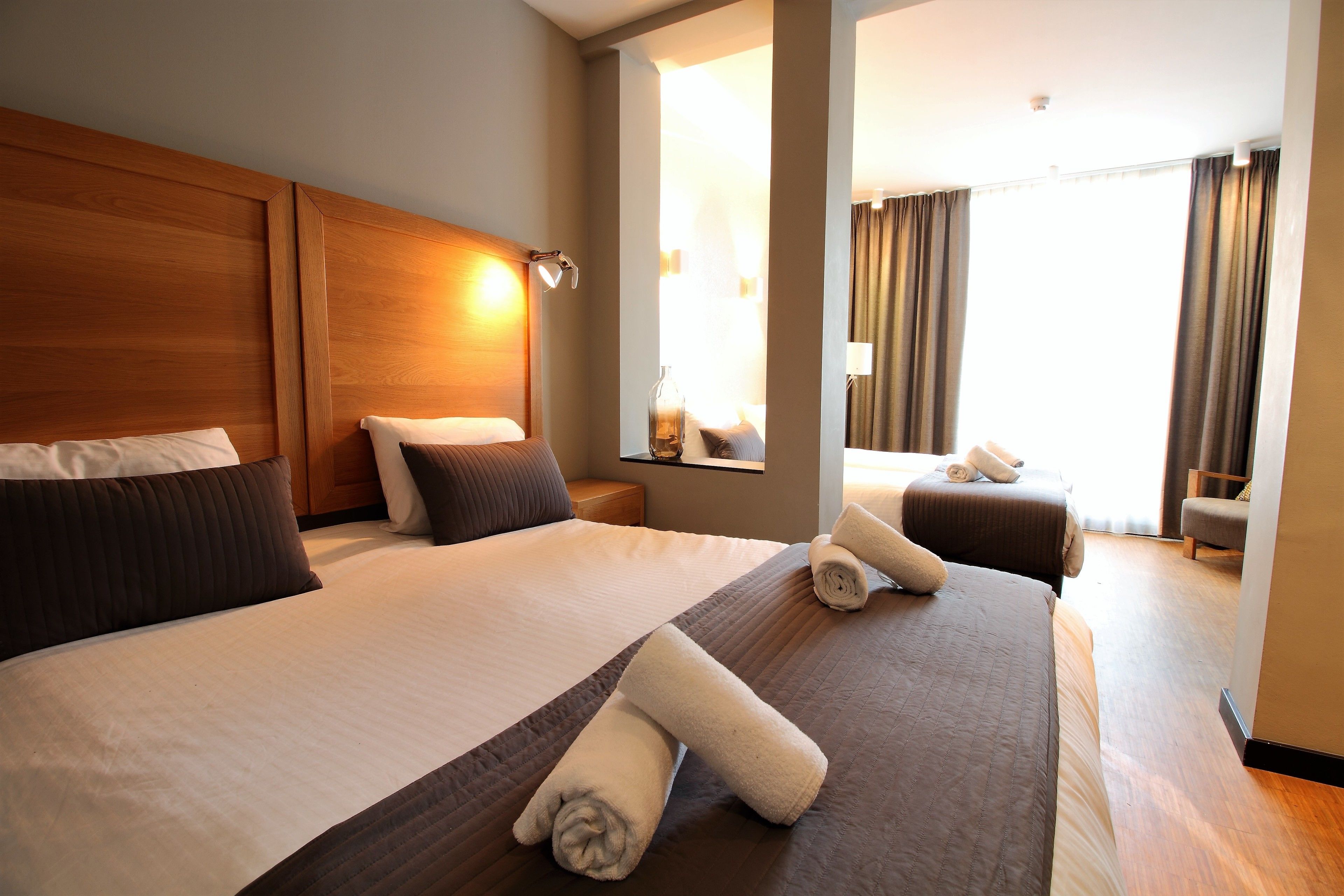 family room | in-room safe, desk, blackout curtains, iron/ironing board