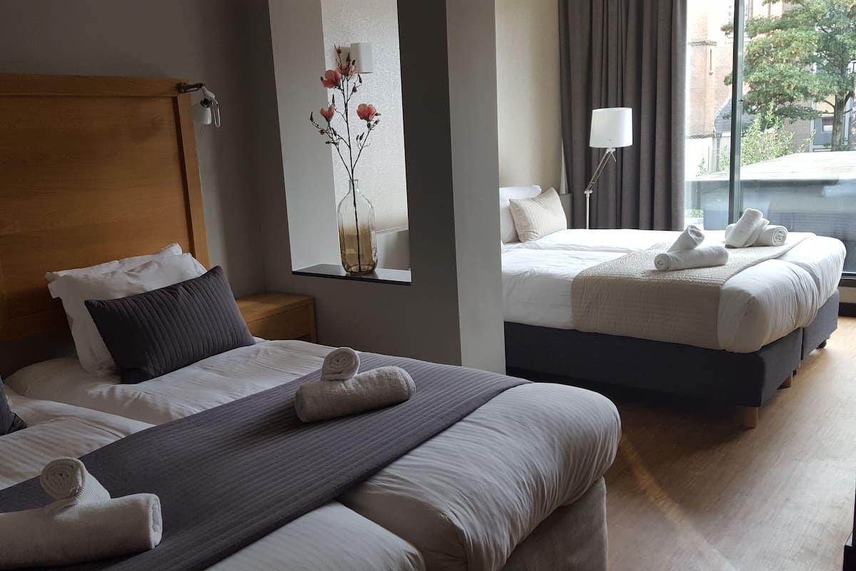 Family Room | In-room safe, desk, blackout curtains, iron/ironing board