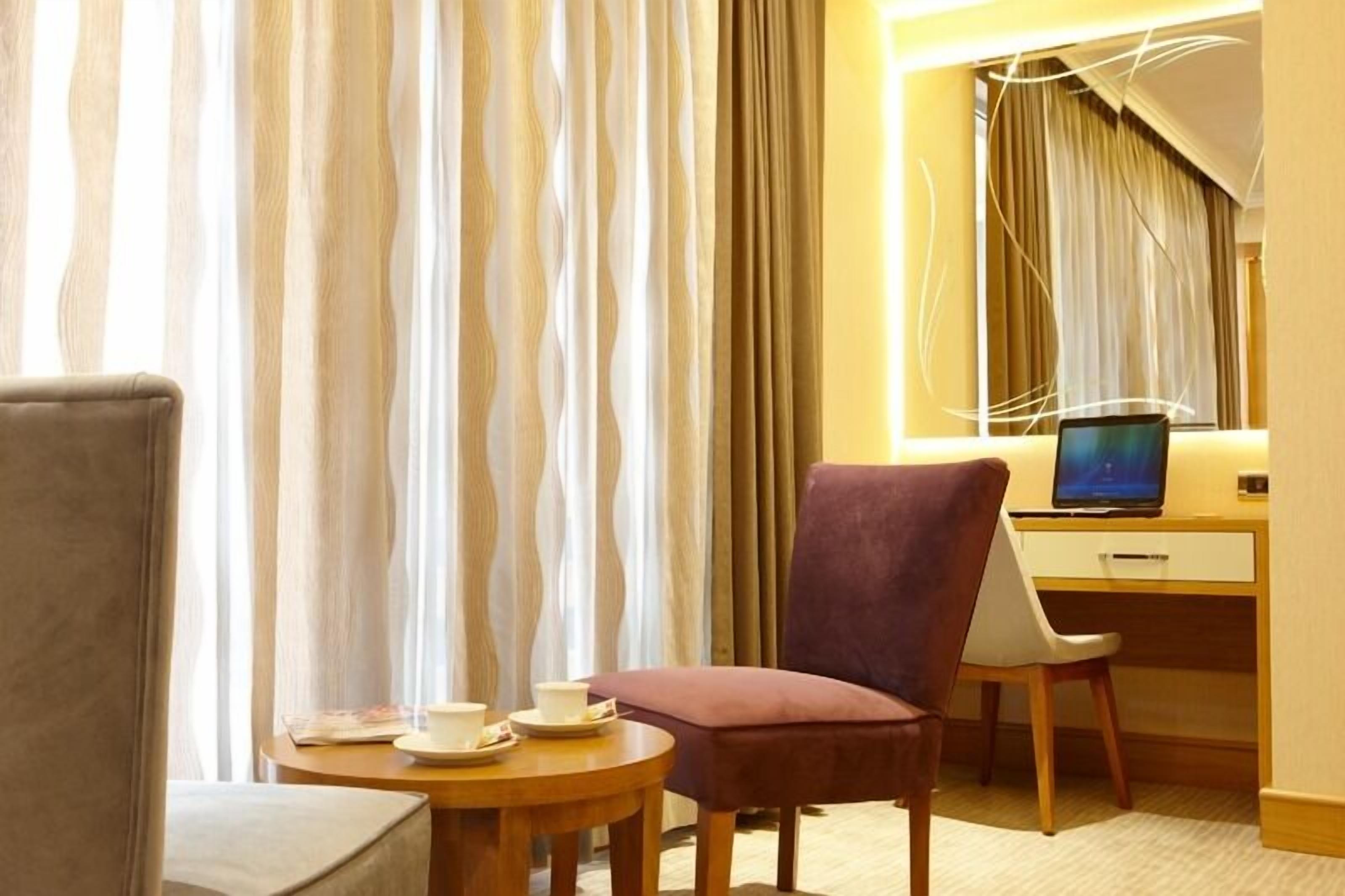 deluxe suite | living area | led tv, heated floors