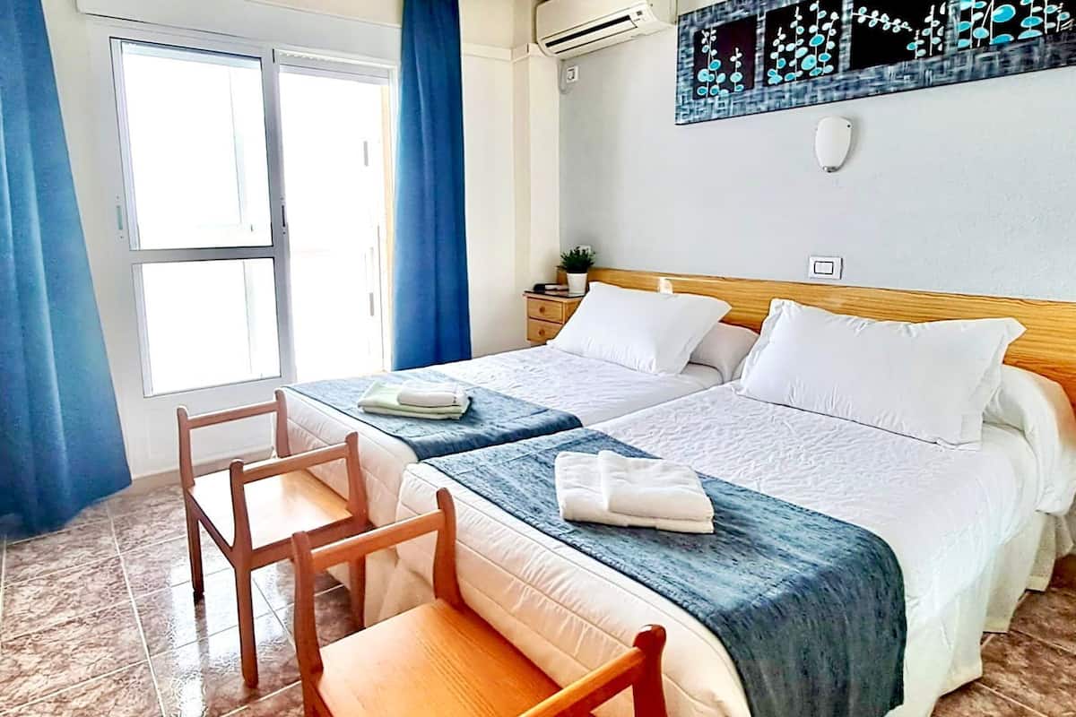 Economy Double Room | Minibar, individually decorated, individually furnished, desk