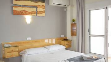 Economy Double Room | Minibar, individually decorated, individually furnished, desk