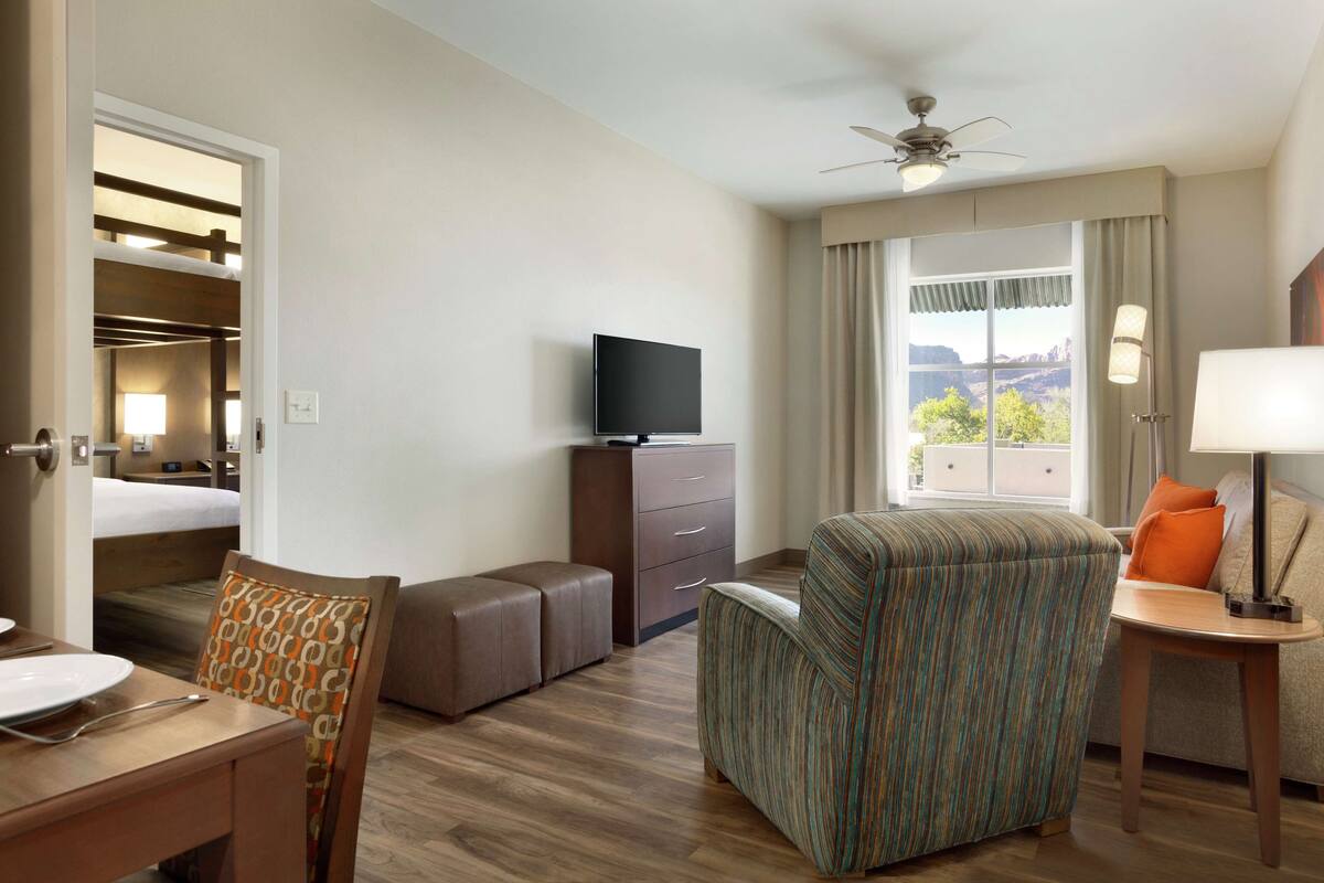 Master Suite, 2 sets of Queen Bunk Beds, Non Smoking | Living area | 46-inch flat-screen TV with cable channels, TV