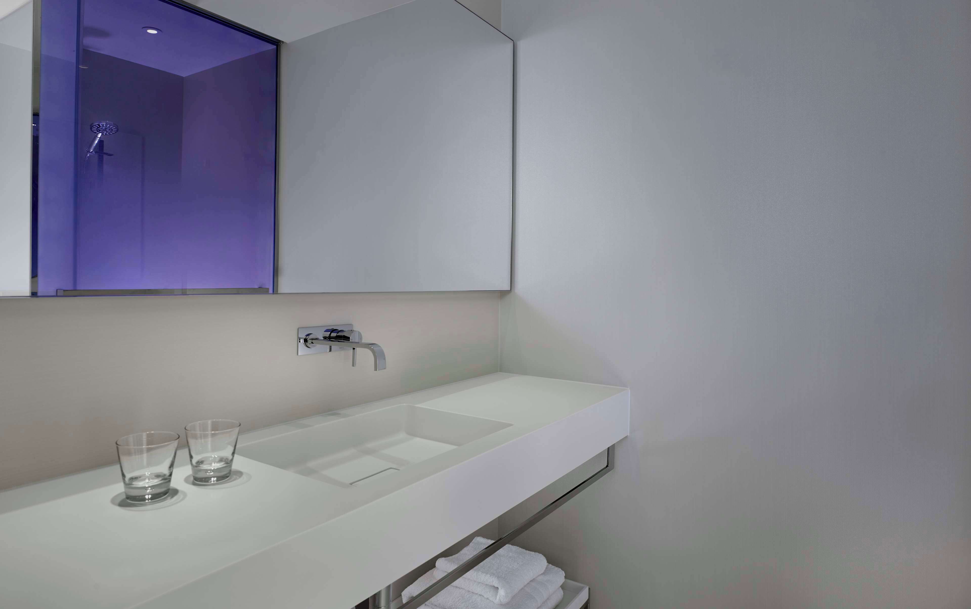 shower, designer toiletries, hair dryer, towels