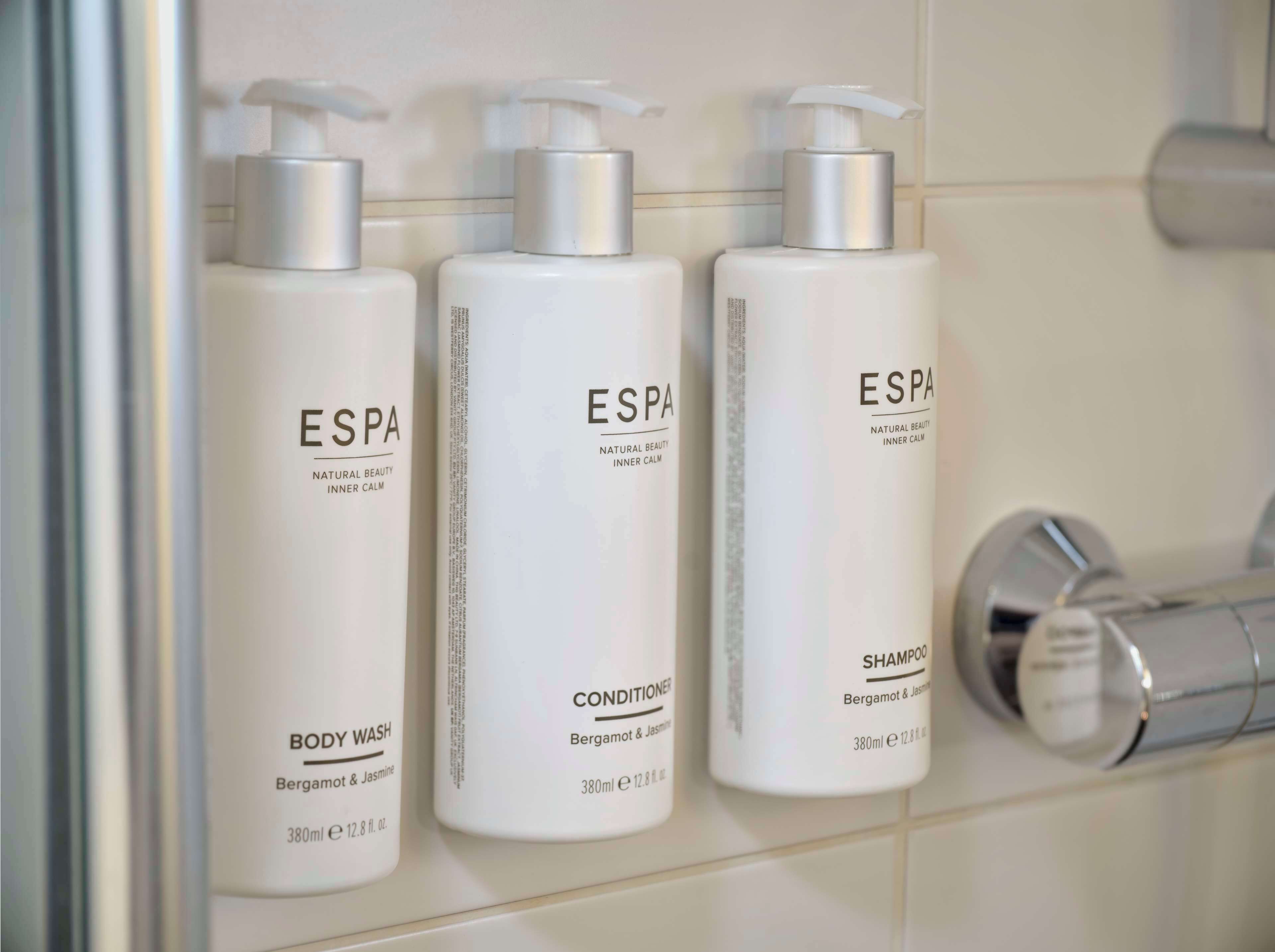 shower, designer toiletries, hair dryer, towels