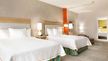 Ropa de cama de alta calidad y caja de seguridad en la habitación