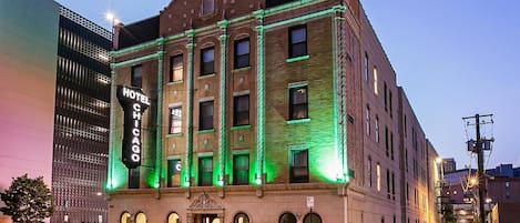 A historic hotel building with a prominent sign reading "HOTEL C CHICAGO."