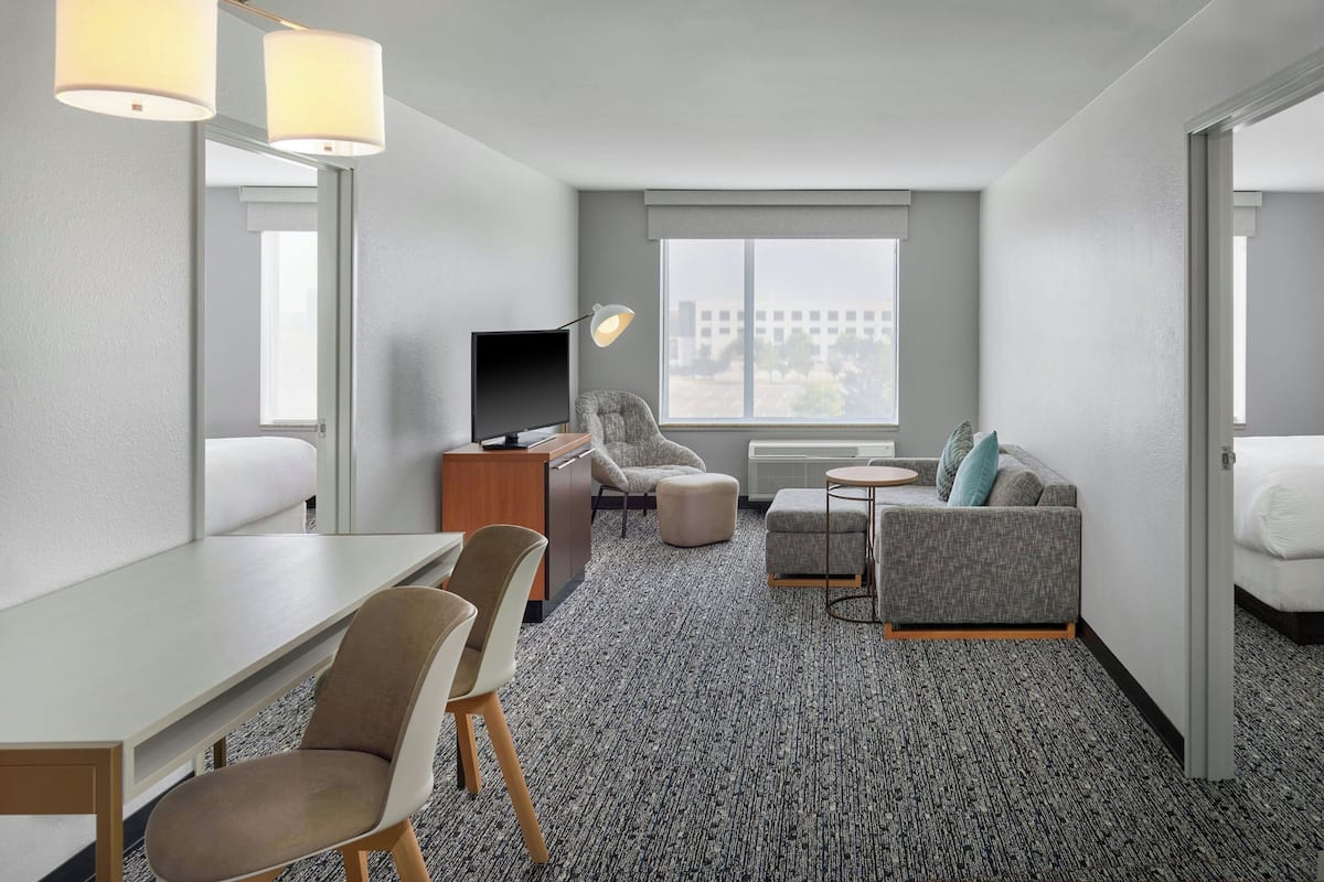 Suite, 2 Bedrooms, Non Smoking, City View | Living room | 32-inch Smart TV with satellite channels, TV, Netflix