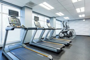 A gym with treadmills, exercise bikes, and a rowing machine. - Fairfield Inn & Suites Richmond Midlothian (Richmond)