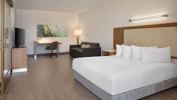 Hypo-allergenic bedding, desk, laptop workspace, blackout drapes