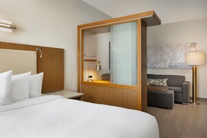 Hypo-allergenic bedding, desk, laptop workspace, blackout curtains