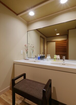 Separate tub and shower, free toiletries, hair dryer, slippers