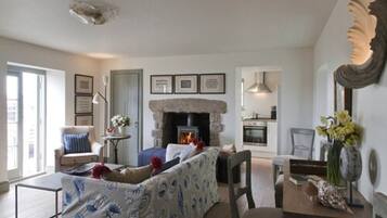 Family Room, Sea View | Living room | Flat-screen TV