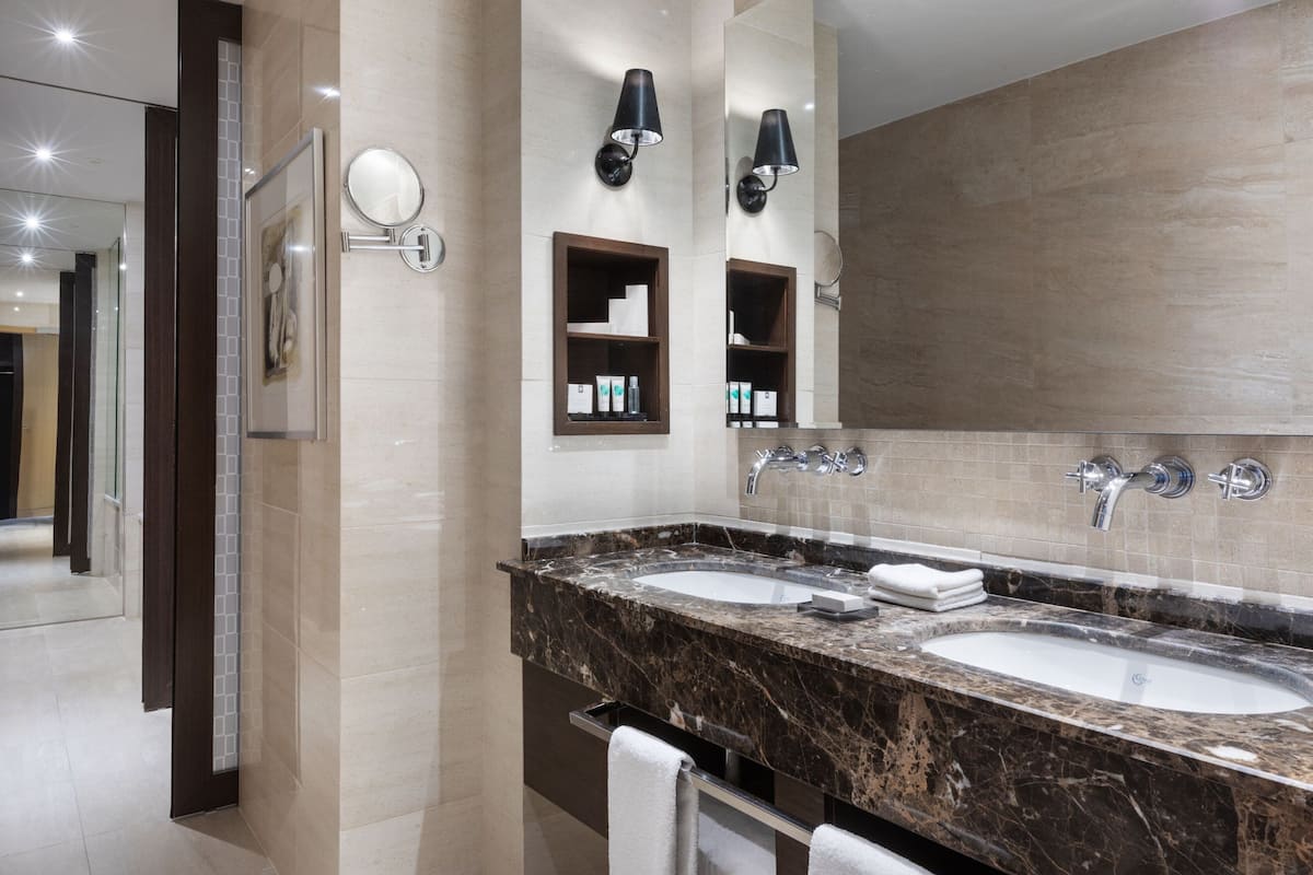 executive suite, 1 king bed with sofa bed | bathroom | shower, hair dryer, slippers, towels