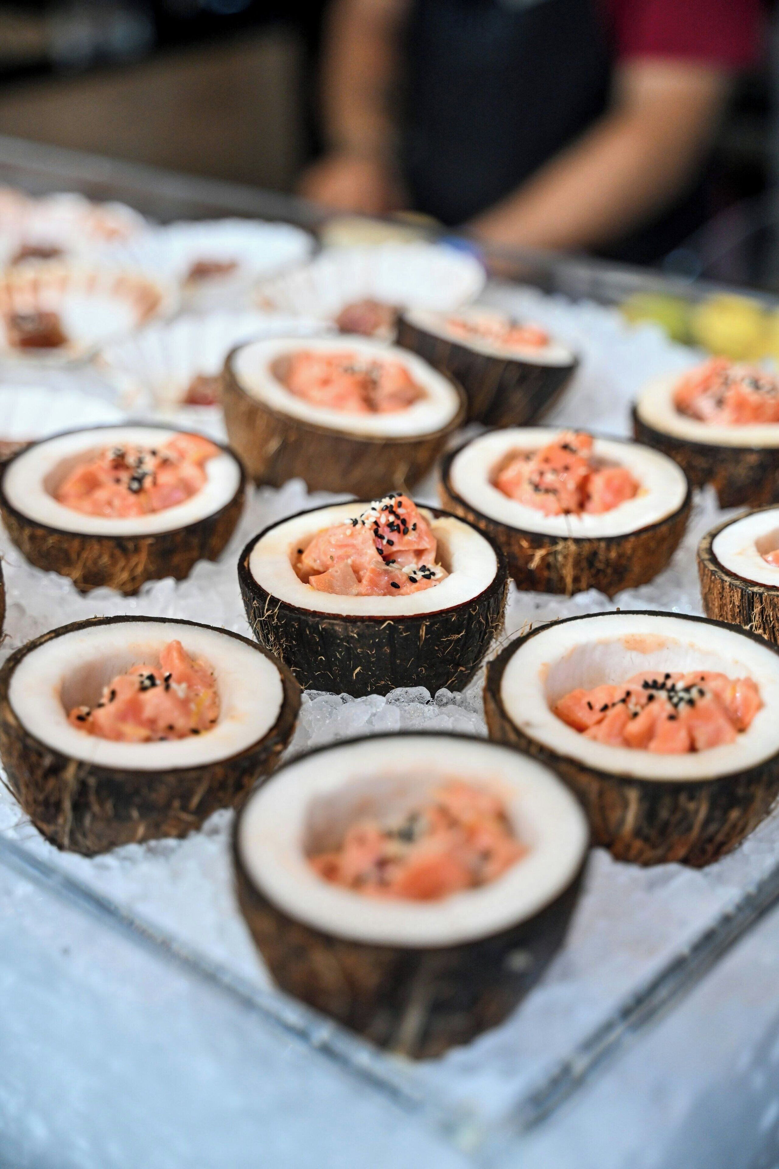 A display of food items, specifically seafood, arranged on a bed of ice.