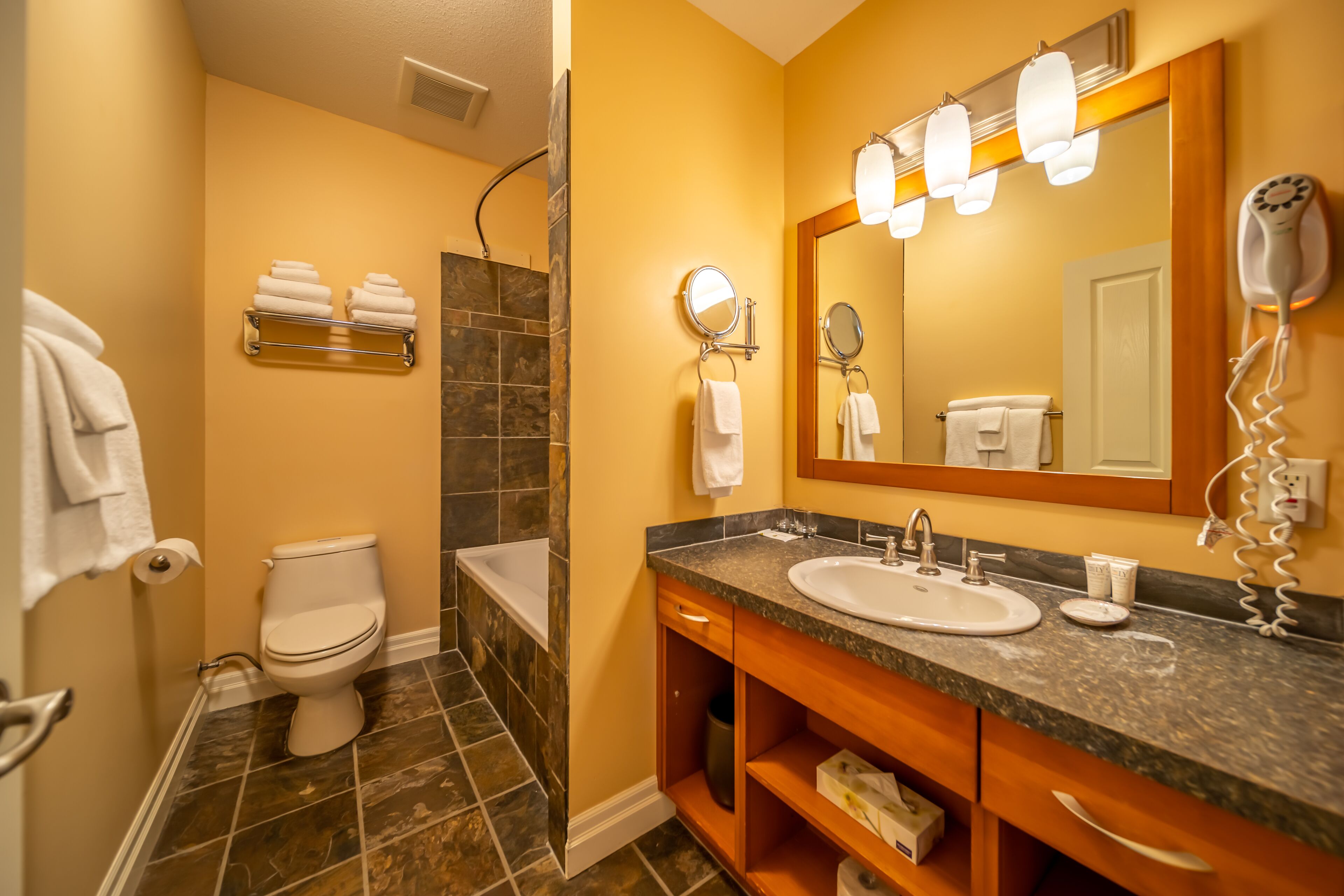 comfort suite, 1 queen bed with sofa bed | bathroom | free toiletries, hair dryer, bathrobes, towels