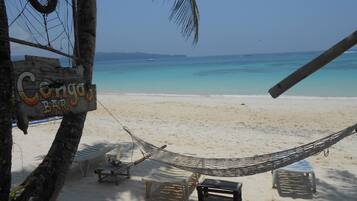 Beach nearby, white sand, beach towels, beach yoga