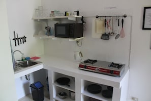 Fridge, microwave, stovetop, cookware/dishes/utensils