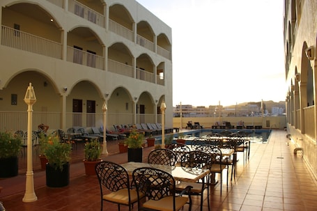 Outdoor pool, open 8 AM to 9 PM, sun loungers