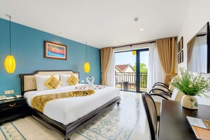 Deluxe Room, Balcony | Minibar, in-room safe, desk, laptop workspace