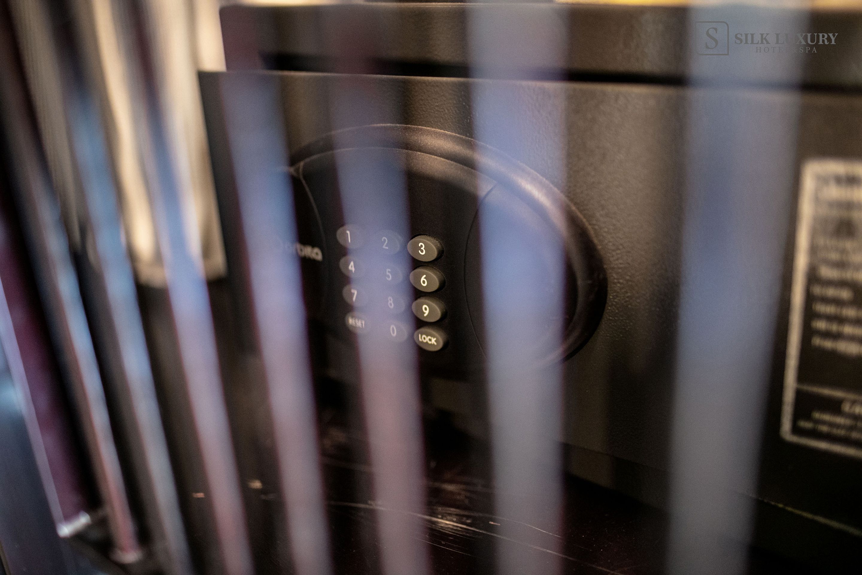 A close-up of a keycard reader with a keypad.