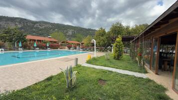 Outdoor pool, pool umbrellas, pool loungers