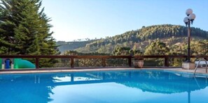 Indoor pool, seasonal outdoor pool, pool umbrellas, sun loungers