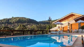 Indoor pool, seasonal outdoor pool, pool umbrellas, pool loungers