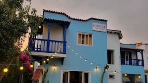 A two-story building with a sign reading "HOSTAL THE PLACE". - Hostal The Place Miraflores (Lima)