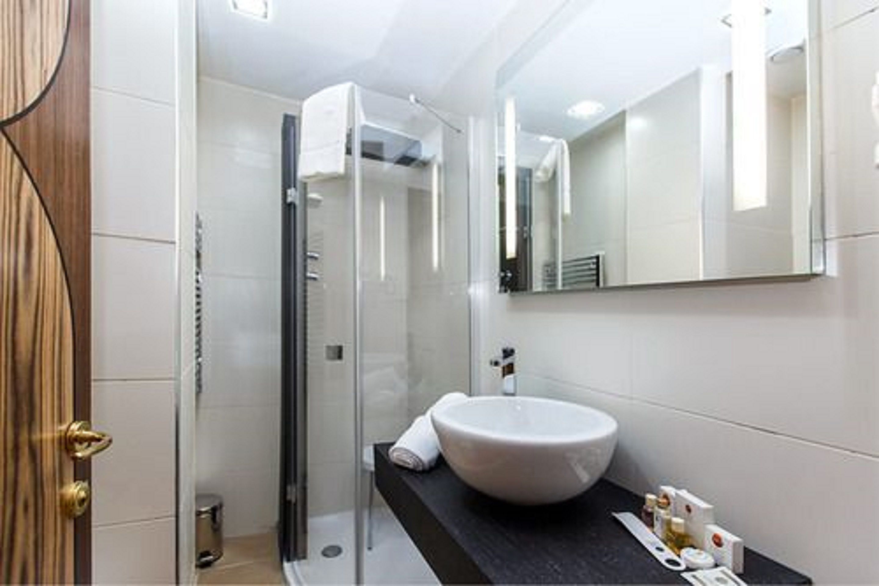 Designer toiletries, hair dryer, bidet, towels