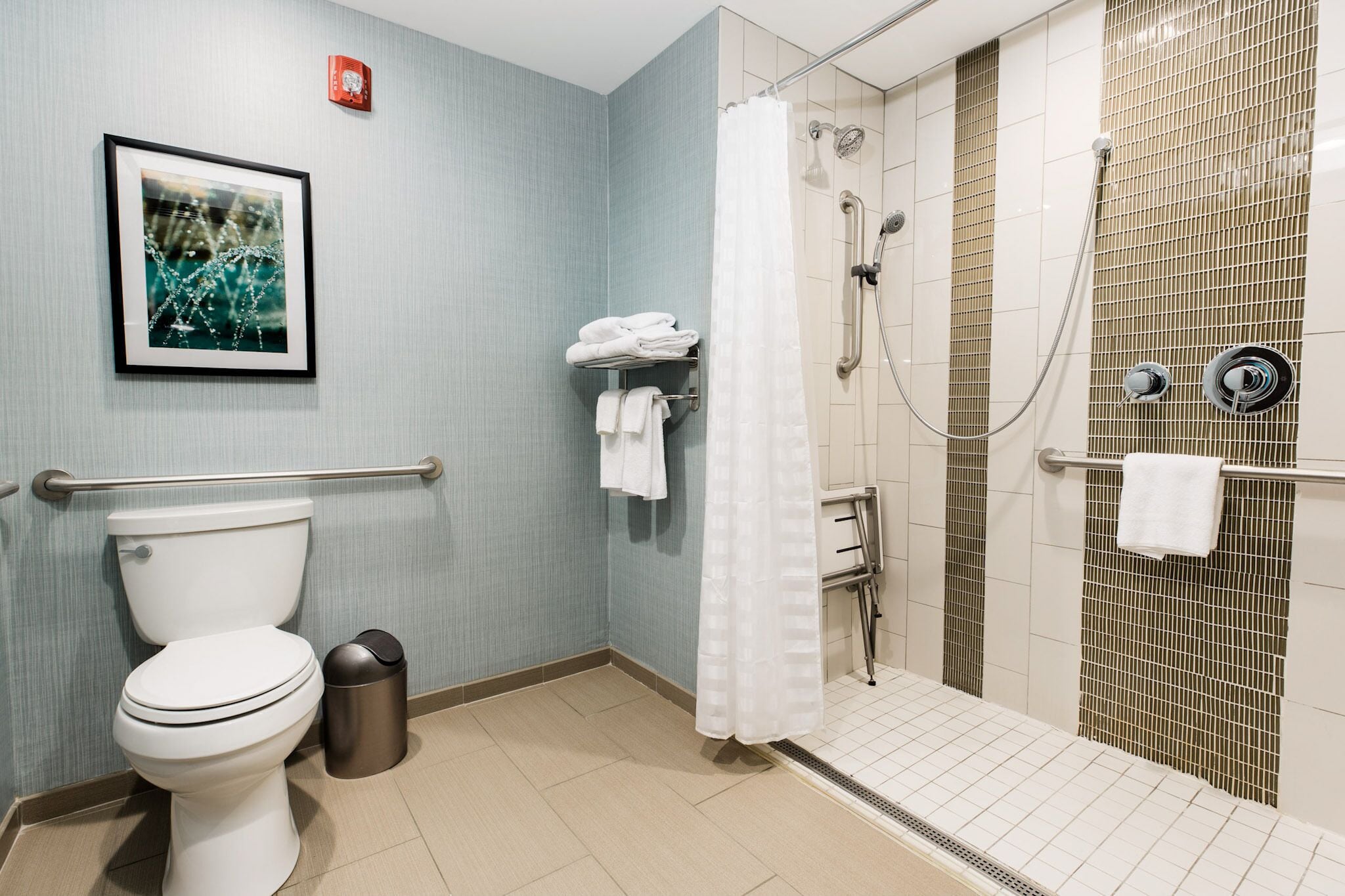 combined shower/bathtub, designer toiletries, hair dryer, towels